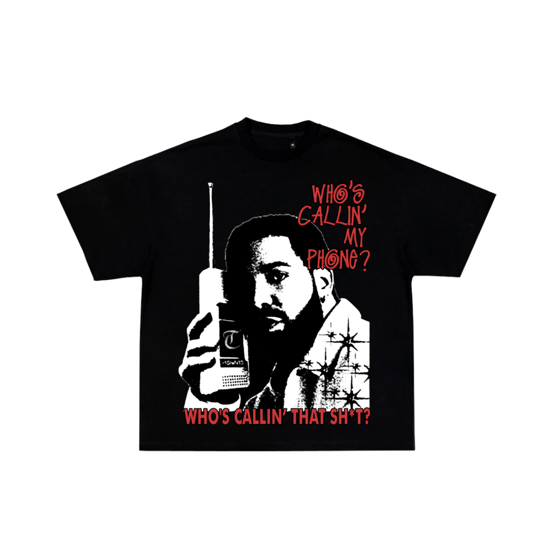Black t-shirt with graphic of a man holding a phone and text 'Who's Callin' My Phone?' on a white background